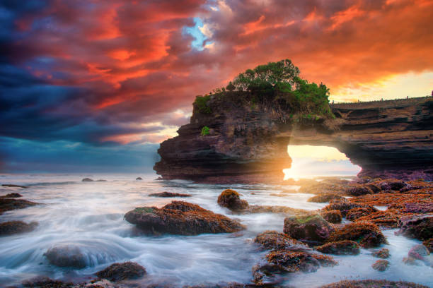 Tanah Lot Temple on sea at sunset in Bali Island, Indonesia. Tanah Lot Temple on sea at sunset in Bali Island, Indonesia. tanah lot sunset stock pictures, royalty-free photos & images