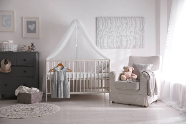 istock Baby room interior with comfortable crib and armchair 1349706238