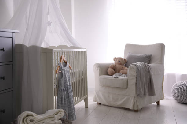 istock Baby room interior with comfortable crib and armchair 1349706856