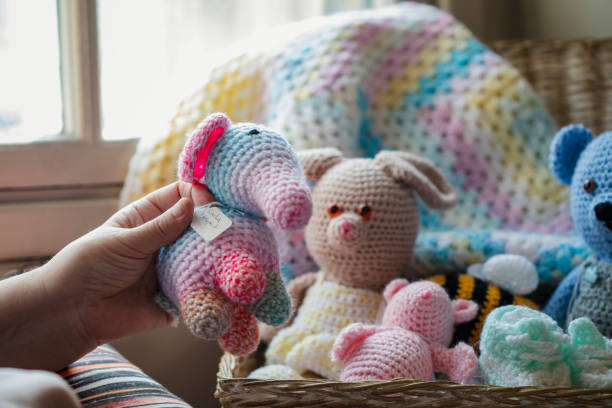 Close up of various crocheted animals being sold in a second hand store in the North East of England.