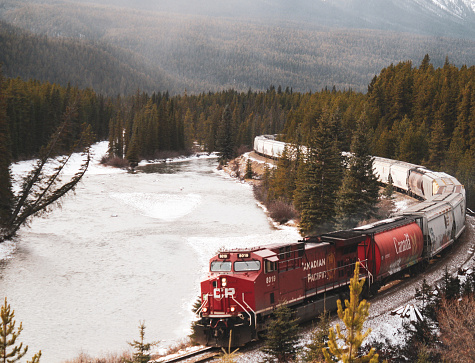 Canadian Pacific Railway train coming around the bend at Moran't Curve in Banff National Park, Alberta. Picture taken in the early winter of 2019.