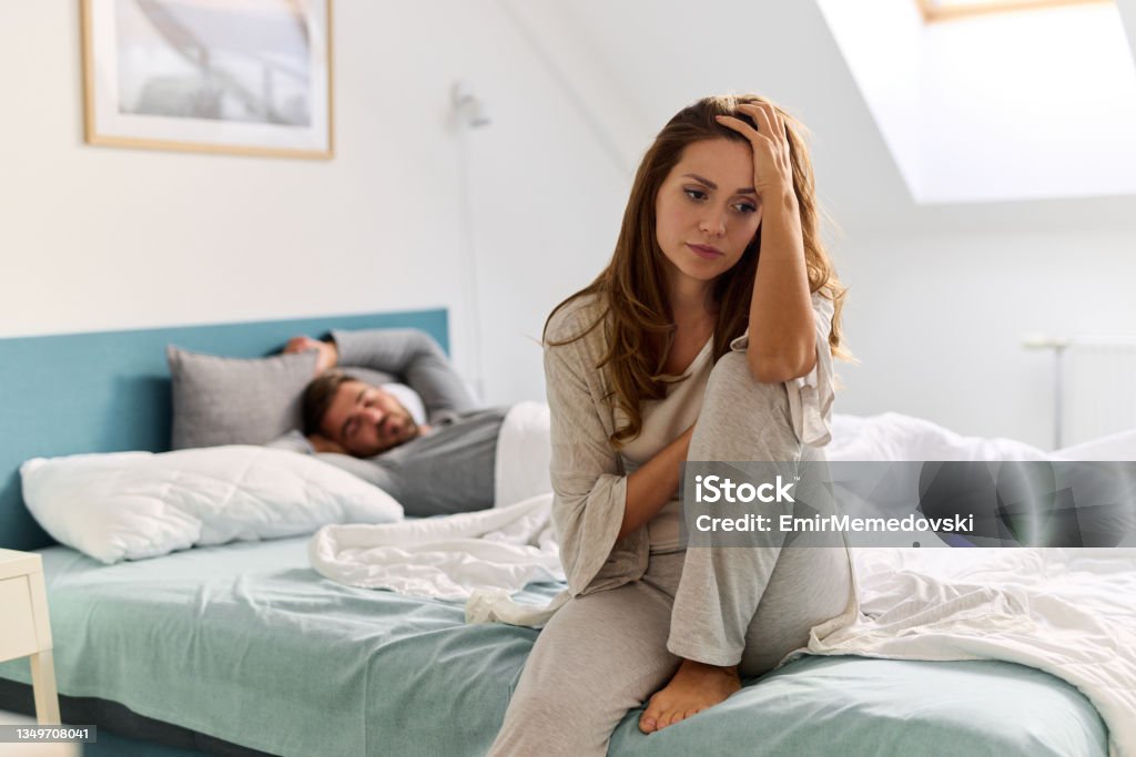 Upset woman thinking about relationship problems and lover indifference Couple - Relationship Stock Photo