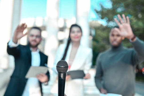istock Journalists Of Different Ethnicities Preparing For Outdoor Interview 1349708819