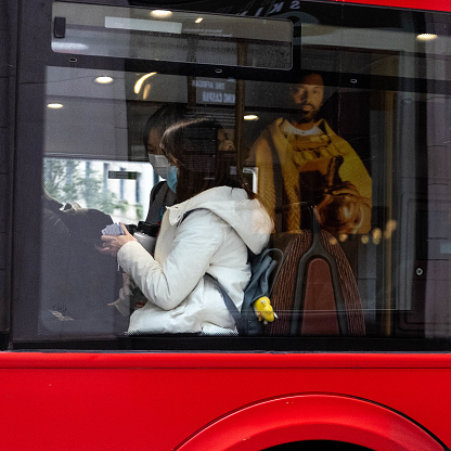 London England UK October 2021, Candid Image Of A Woman Sitting On A London Bus Wearing Covid-19 Coronavirus Protective Mask