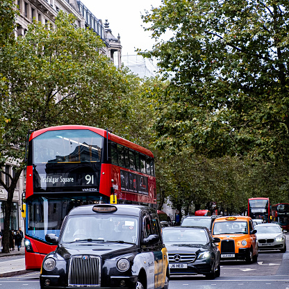 London England October 22 2021, Traditional London Taxi's And Red Double Decker Bus On A Road In  Aldwych City Of Westminster London Engalnd UK