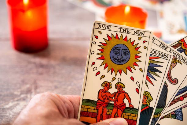 istock Fortune teller reading a future by tarot cards 1349711614