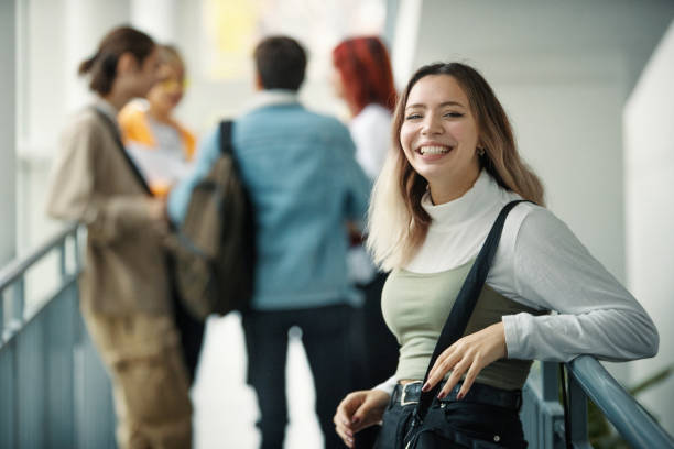 istock Group of high school students in a hallway. 1349713977
