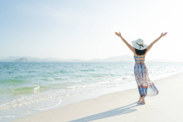 istock Happy woman wearing beach sun hat and beautiful bikini 1349715680