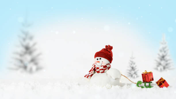 istock Smiling snowman with sled and gifts 1349717055
