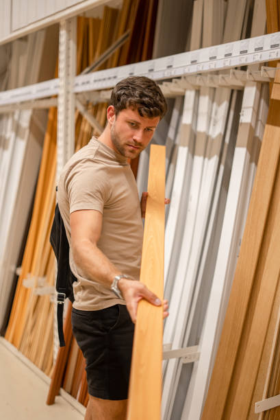 istock Customer in shop with floor moldings 1349717215