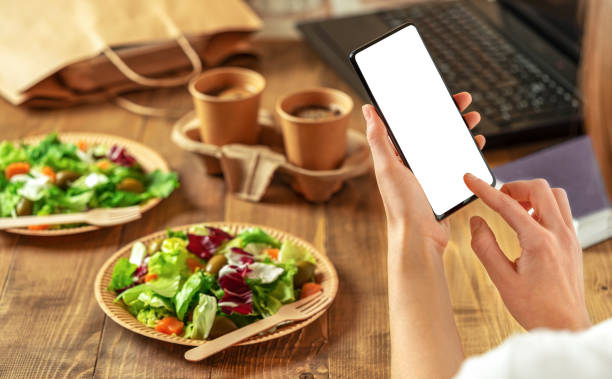 istock An order of healthy food through mobile app. 1349717687