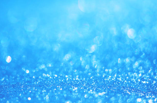 istock Abstract blurred bokeh background of glowing blue ice. Background 1349717902