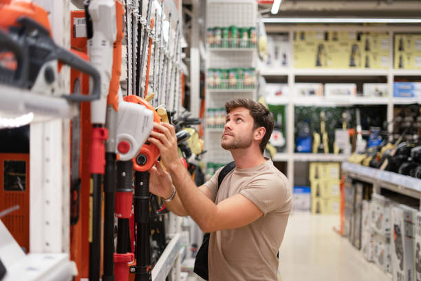istock Guy shopping in store of power tools 1349729260
