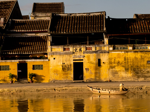 A traditional boat in a canal in Hoi An, Vietnam