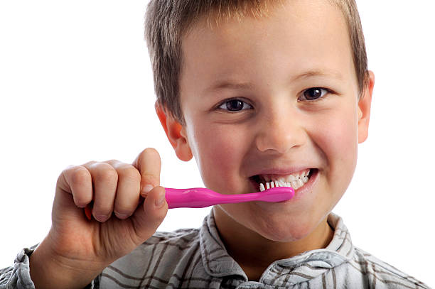 istock little boy cleaning his teeth 134973184