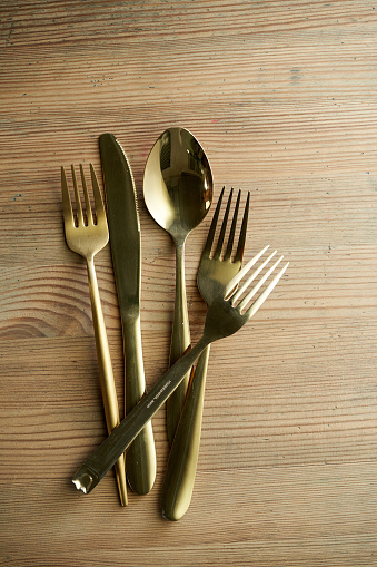fork knife spoon on wood table top