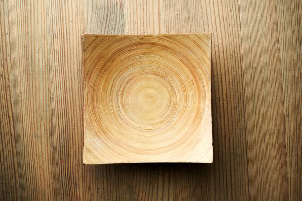 wood square plate on wood table top