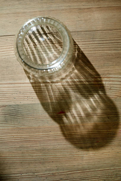 istock empty saving jar or glass jar on wood table top 1349749806