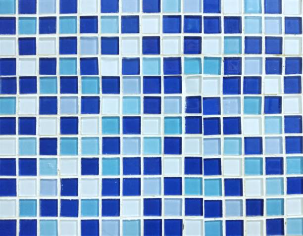 istock Background of blue, light blue, white, small ceramic tiles arranged in alternating colors. 1349753792