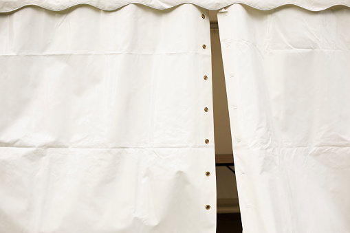 White tent. Tent from the rain. The place of trade is made of awning. Banner material.