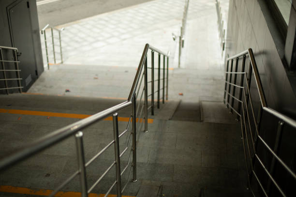 istock Steel handrails for support when descending the steps. 1349761685