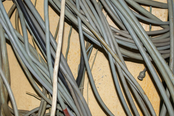 istock gray wires on a background of a yellow wall 1349761715