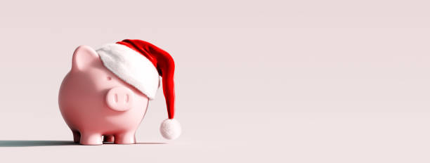 istock Piggy bank with Santa hat on light gray background 1349764318