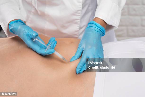 Cosmetologist Makes Lipolytic Injections To Burn Fat On The Stomach And Waist Of A Man Aesthetic Cosmetology In A Beauty Saloncosmetology Concept Stock Photo - Download Image Now
