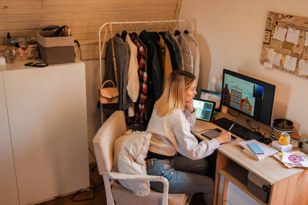 istock From her room, female graphic designer working on a new project using a wealth of technology 1349767431