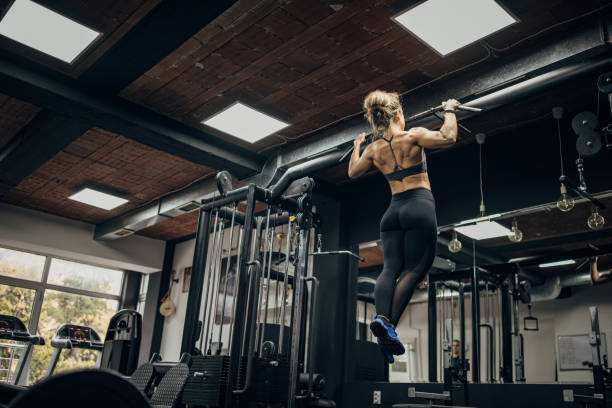 istock Woman exercising in gym 1349768239