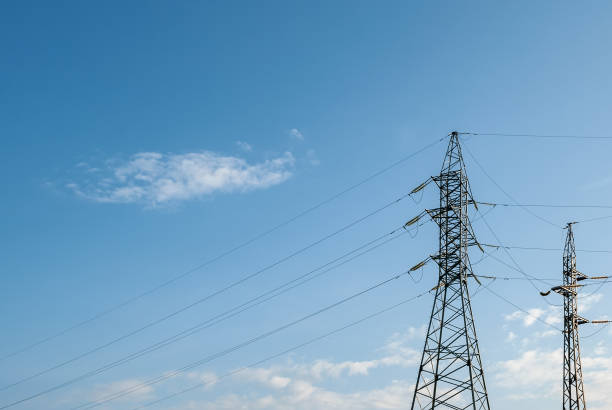 Electric power transmission tower. Electricity distribution infrastructure. Compressors Distribution Technology Electric power transmission tower. Electricity distribution infrastructure. Compressors Distribution Technology power mast stock pictures, royalty-free photos & images