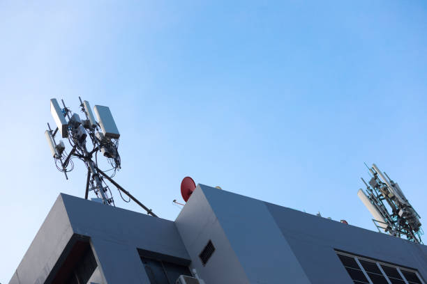 istock Two masts with wireless repeater towers for 4g and 5g on rooftop 1349771572