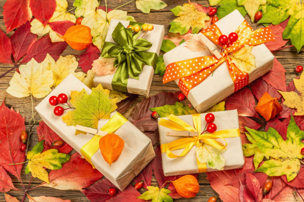 istock Zero waste gift concept with autumn design. Warm sweaters, fall leaves, thematic decor 1349772345