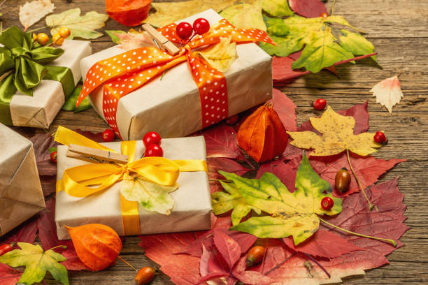 istock Zero waste gift concept with autumn design. Warm sweaters, fall leaves, thematic decor 1349772493