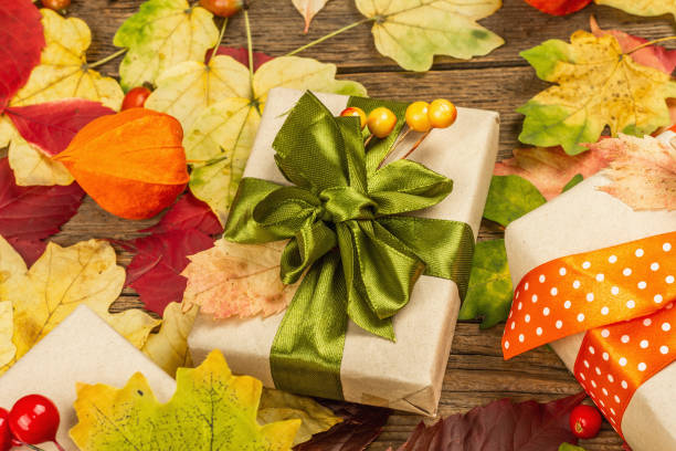 istock Zero waste gift concept with autumn design. Warm sweaters, fall leaves, thematic decor 1349772542