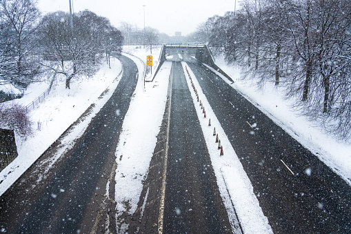 Blizzard conditions on a dual carriageway and slip road in Glasgow, Scotland.