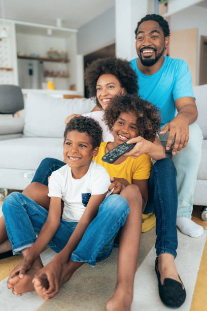 istock Family watching television 1349772868