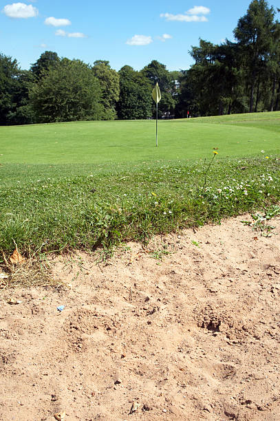 istock Sand bunker and golf green flag 134977487