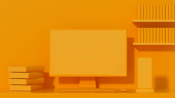 istock Empty computer screen monitor and smart phone on orange background, minimal concept 1349779178