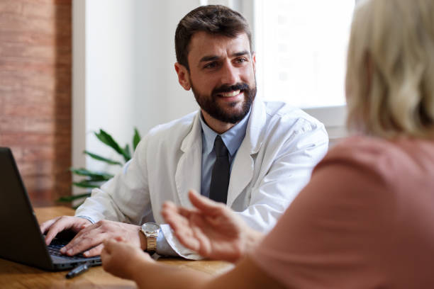istock A smiling young doctor is talking to his patient. 1349781837