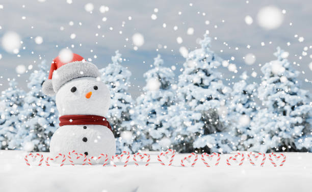 istock snowman with candy canes in a snowy landscape 1349782633