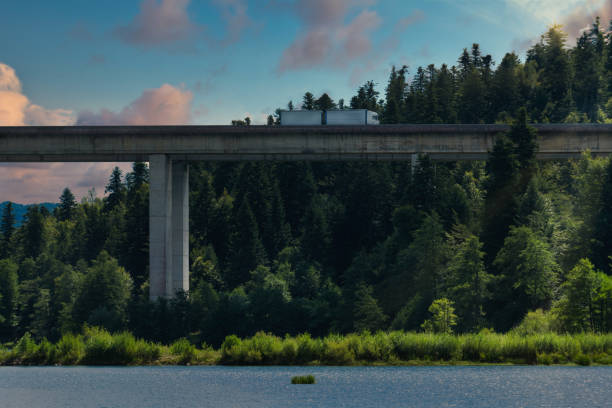 Truck on a highway bridge in the evening. Scene from the Croatian Mountains.