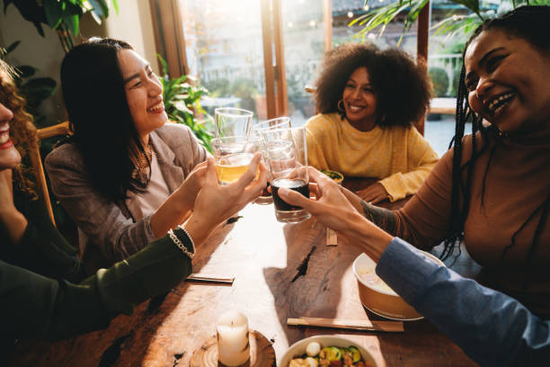 istock A group of friends is toasting together during a dinner party 1349785865