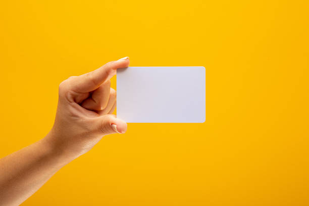 istock Hand hold blank white card mockup with rounded corners 1349789642