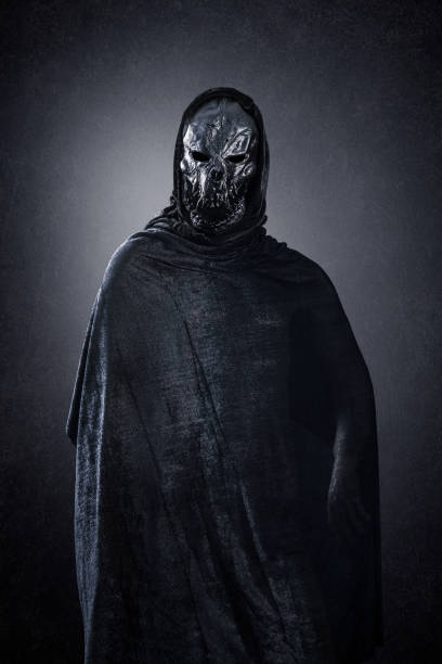 istock Monster in hooded cloak at night 1349790207