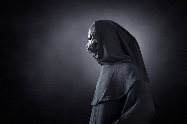 istock Monster in hooded cloak at night 1349790261