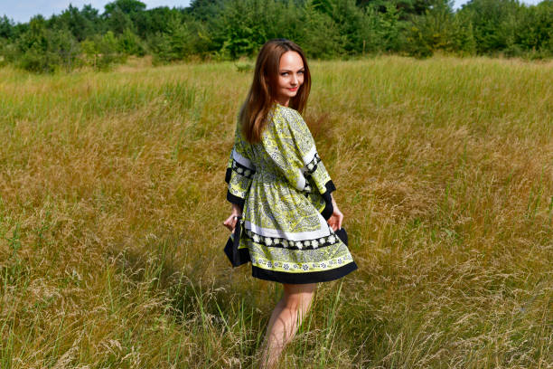 istock Young woman collects wild berries. 1349792052