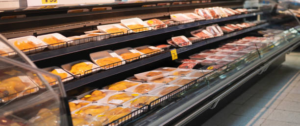 istock Showcase with raw meat in butcher shop. 1349793967