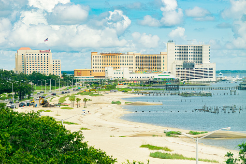 Biloxi, Mississippi, USA - July 1, 2021: Casinos and beach on Biloxi Bay.
