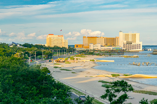 Biloxi, Mississippi, USA - July 1, 2021: Casinos and beach on Biloxi Bay.